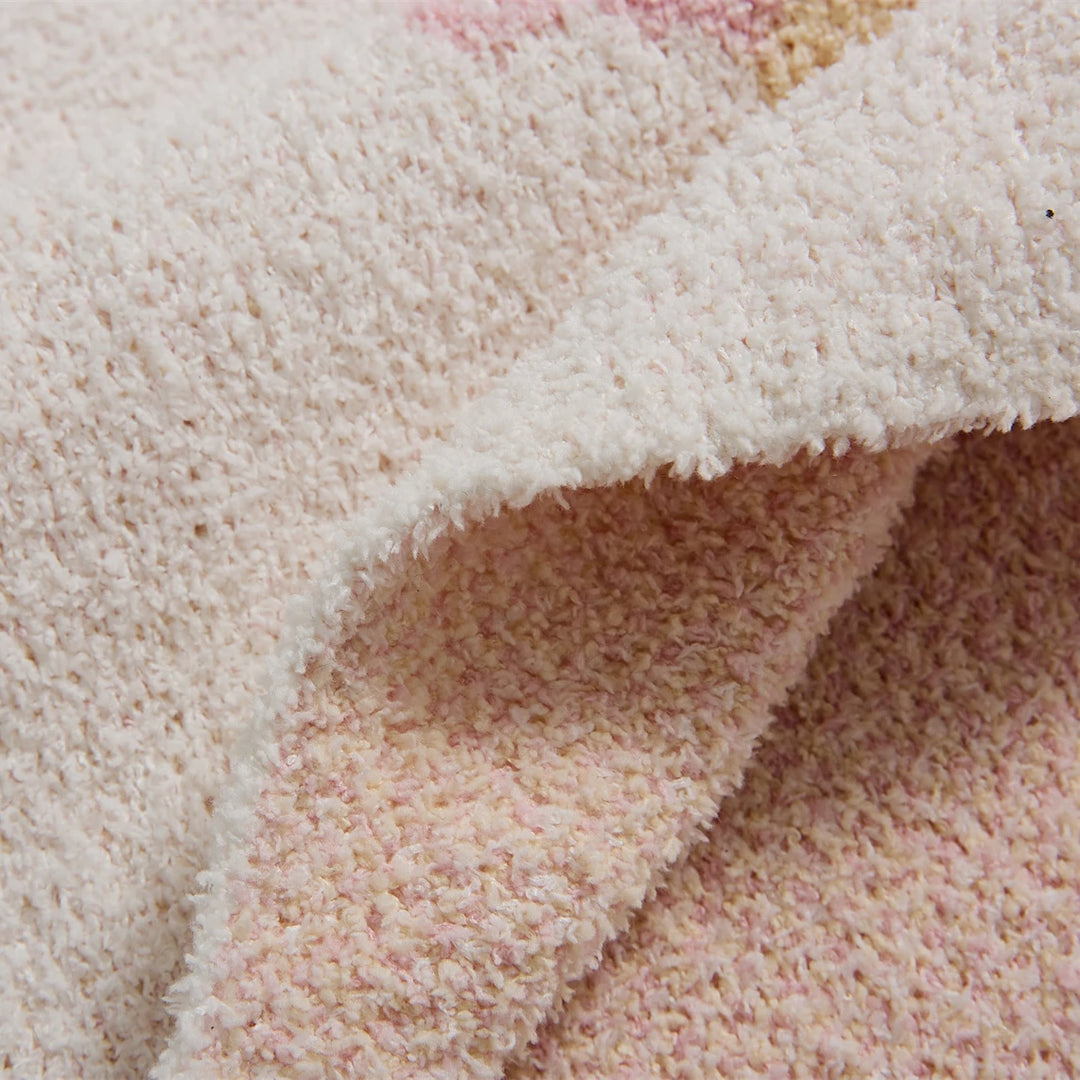 Ice cream pattern blanket close-up showing its thick, curly plush texture and folded edge