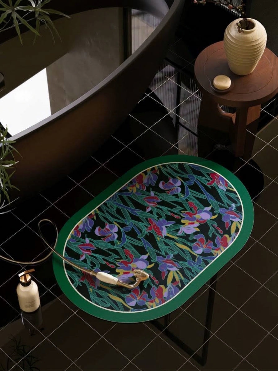 Oval Iris Flower Bathroom Mat with purple flowers, green leaves and a green border beside a bathtub