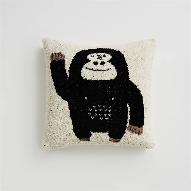 Cream Kawaii Gorilla square pillow with a waving black gorilla on a white background