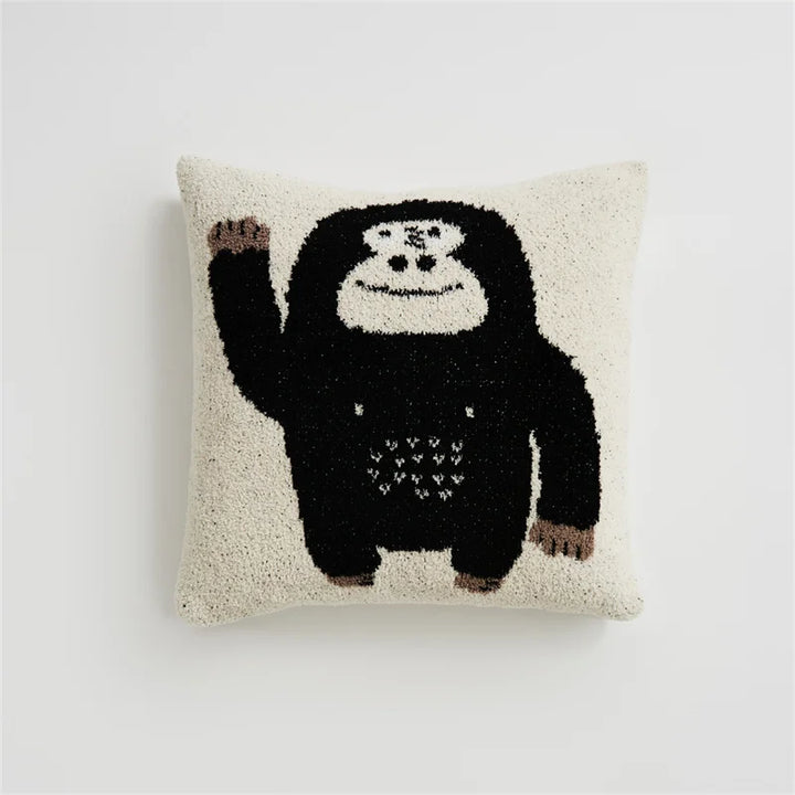 Cream Kawaii Gorilla square pillow with a waving black gorilla on a white background
