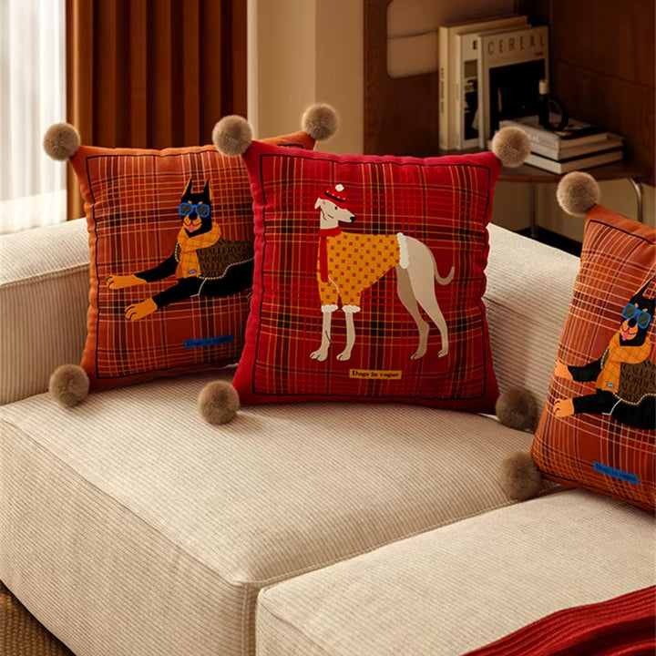 Plaid square dog pillows with Doberman and greyhound illustrations and pom-pom corners