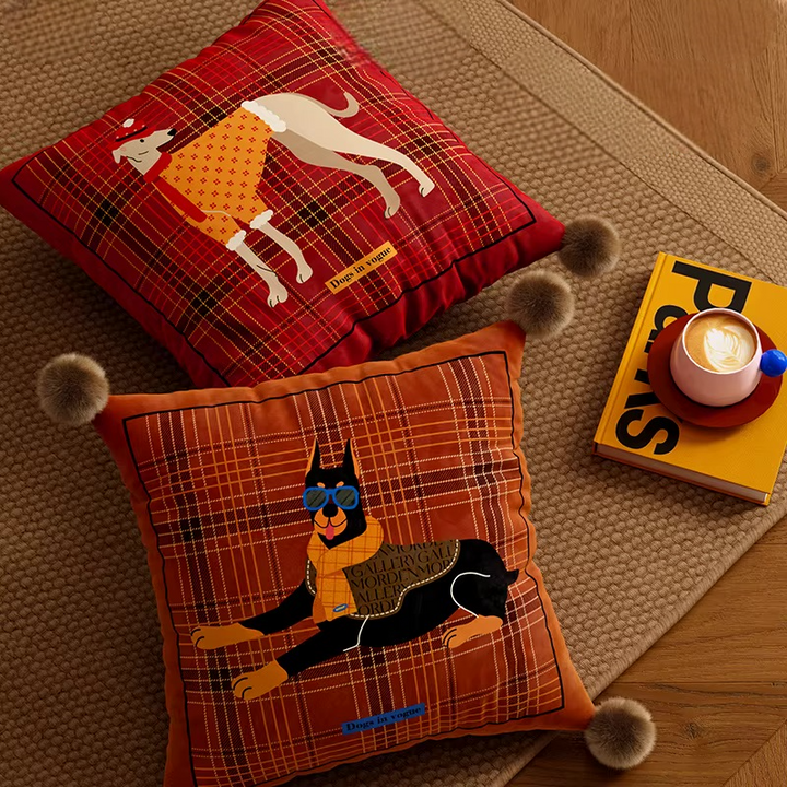 Square Scottish dog pillows with Doberman and greyhound illustrations and pom-pom corners