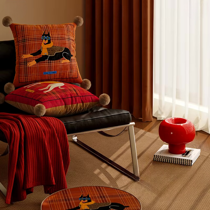 Square rust plaid Doberman pillow stacked with a red greyhound pillow