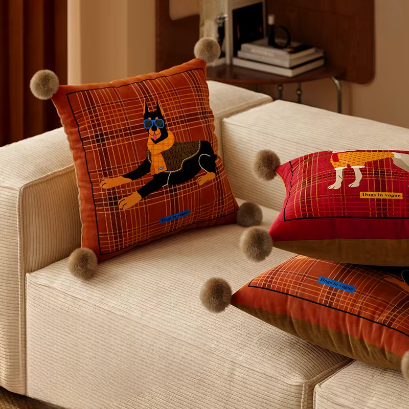 Square rust plaid pillow with Doberman print beside red and rust greyhound pillows