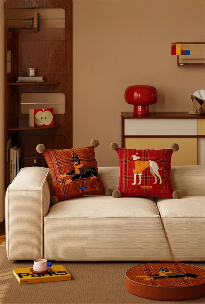 Scottish dog pillows showing Doberman and greyhound designs on plaid covers