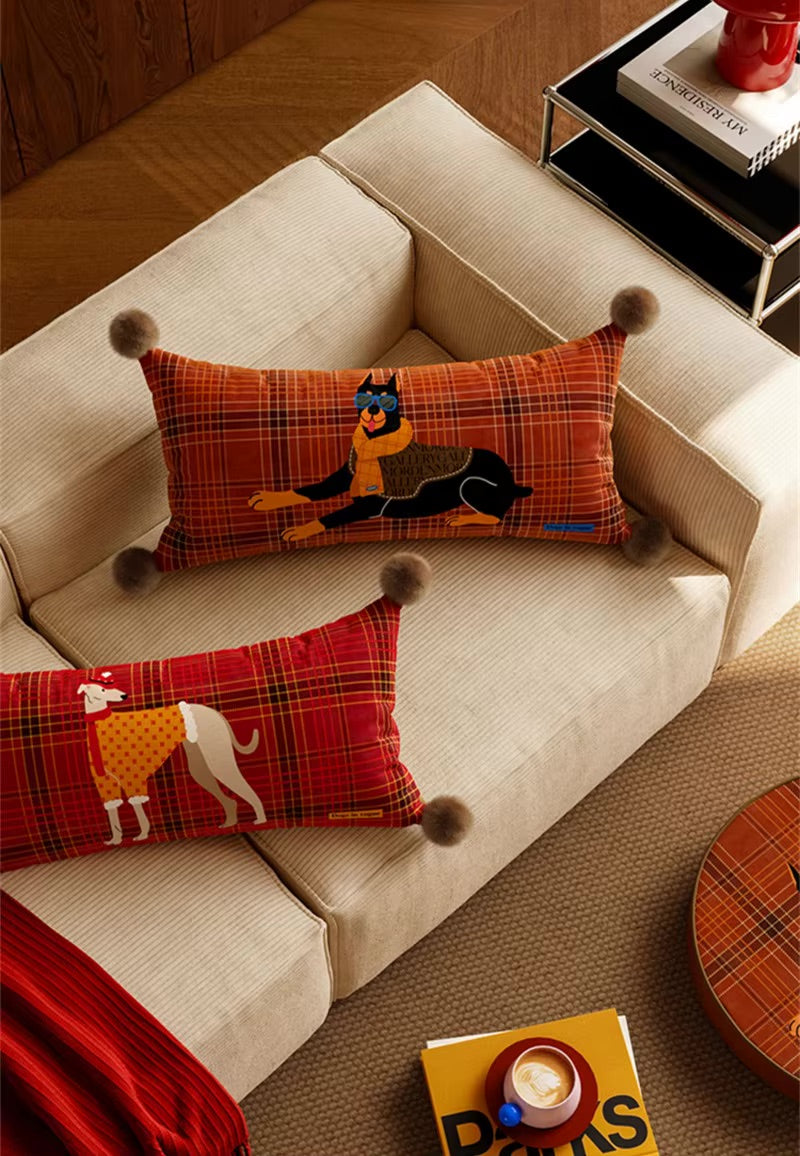 Dog pillows in red and rust plaid with Doberman and greyhound prints and pom-pom corners