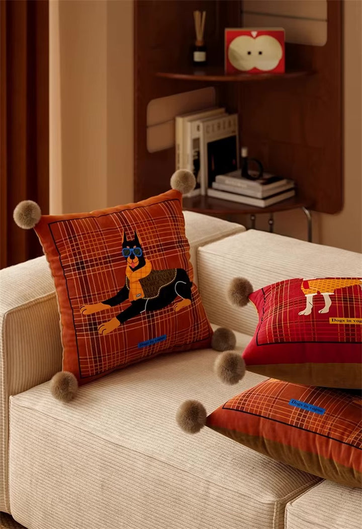 Square rust plaid pillow with Doberman print and pom-pom corners