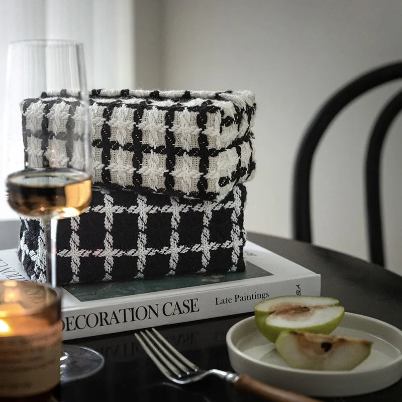 Black and white woven square tissue holder with crosshatch and geometric patterns