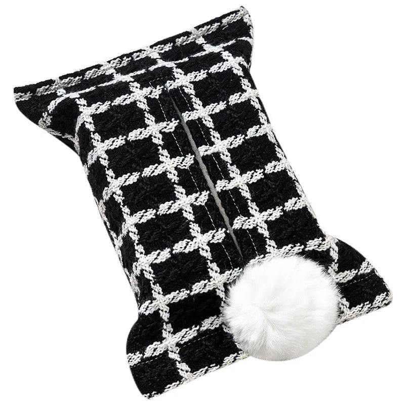 Black tissue pouch with a white windowpane grid and white bunny-tail pom-pom.