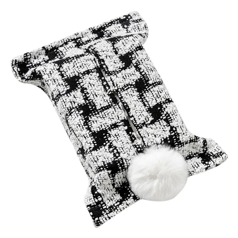 Black and white textured plaid tissue pouch with a white bunny-tail pom-pom.