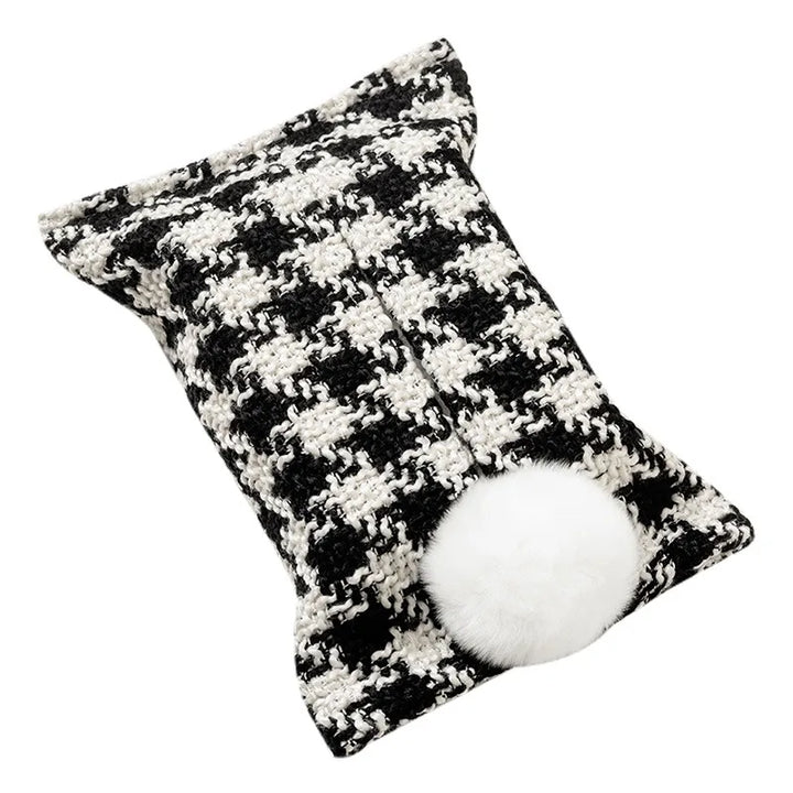 Black and white nubby check tissue pouch with a white bunny-tail pom-pom.