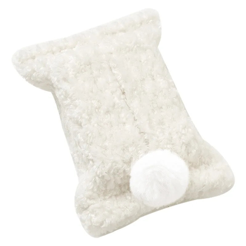 Cream textured tissue pouch with a matching white bunny-tail pom-pom.