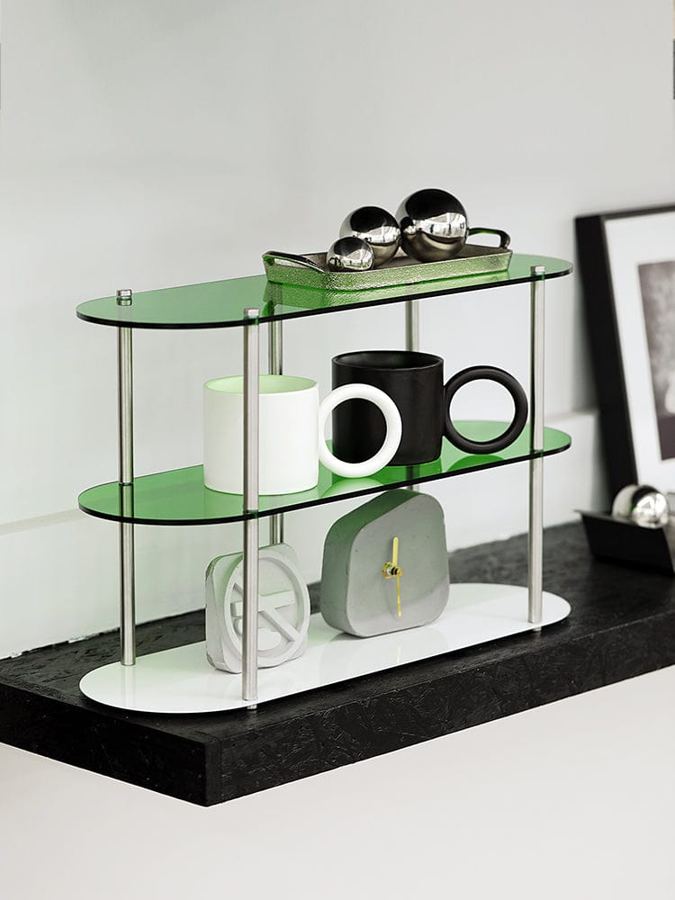 Clean green acrylic rack with some products arranged on three levels.