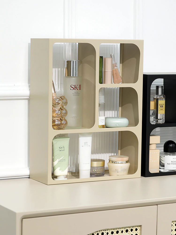 Two acrylic storage holders with wooden and black finish having some beauty products well organized.